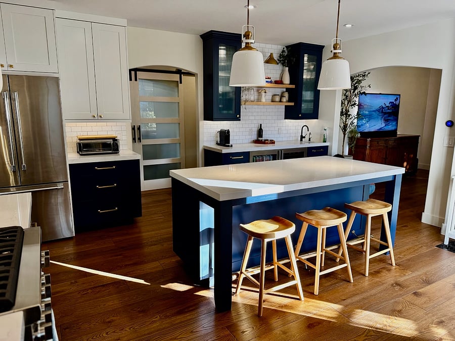 Kitchen island provides the perfect spot for a quick breakfast and a chat.