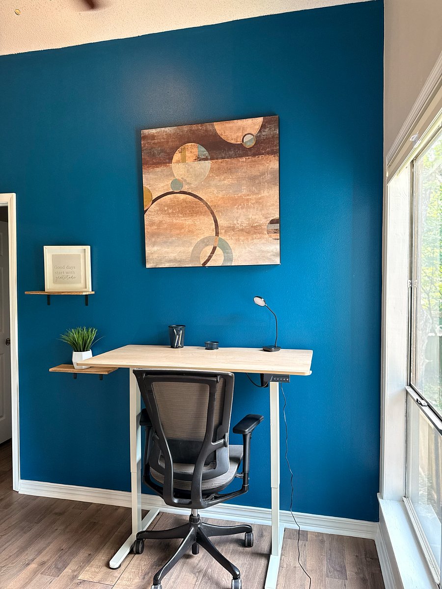 Upstairs work area with vertical movable desk