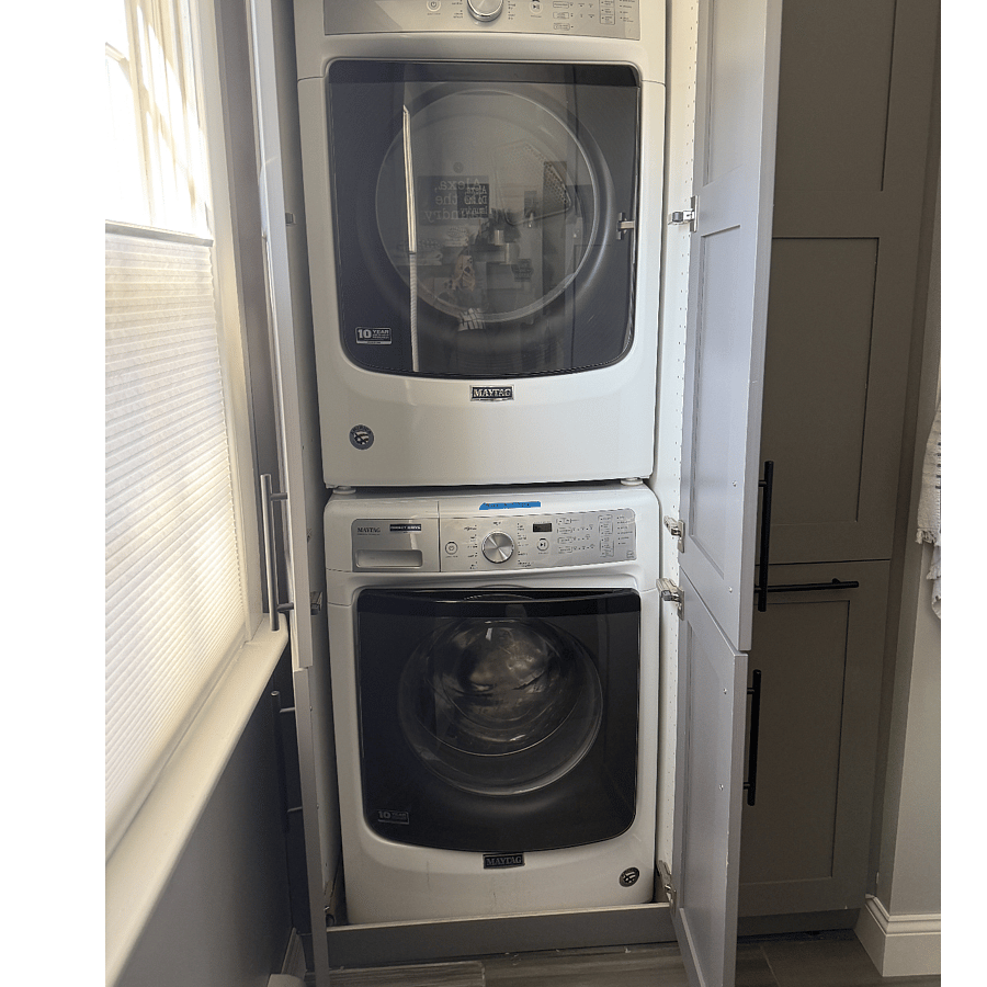 Large stackable laundry available for use even during salon hours. 