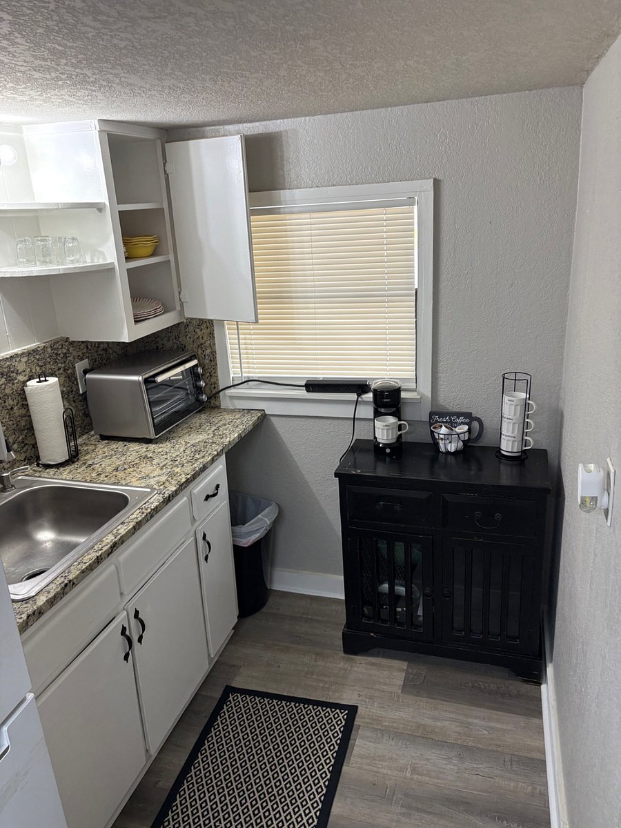 Coffee hutch with k-cup maker, hot plate, silverware and serving utensils