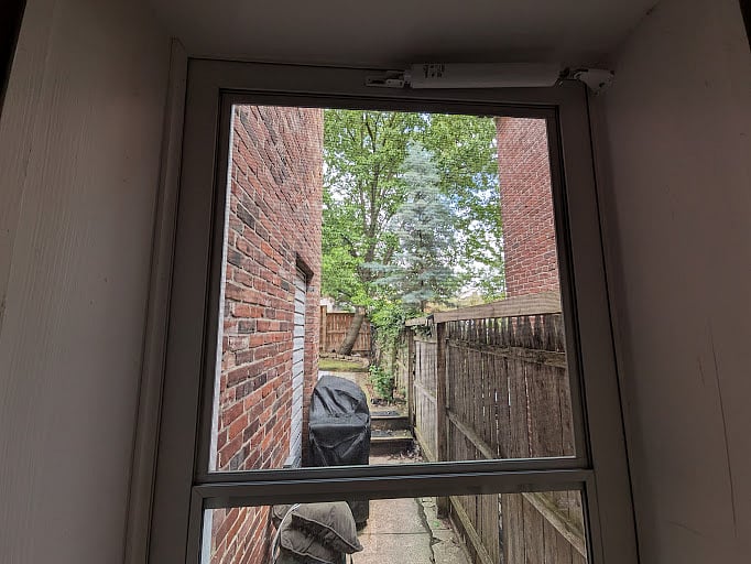 Grill, Outdoor Patio Set in fenced-in backyard leading to dedicated off-street parking