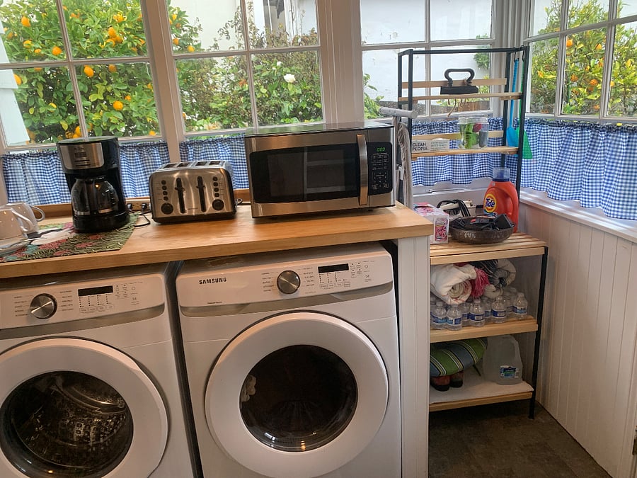 Laundry room and coffee bar off of the kitchen, leads to back yard.