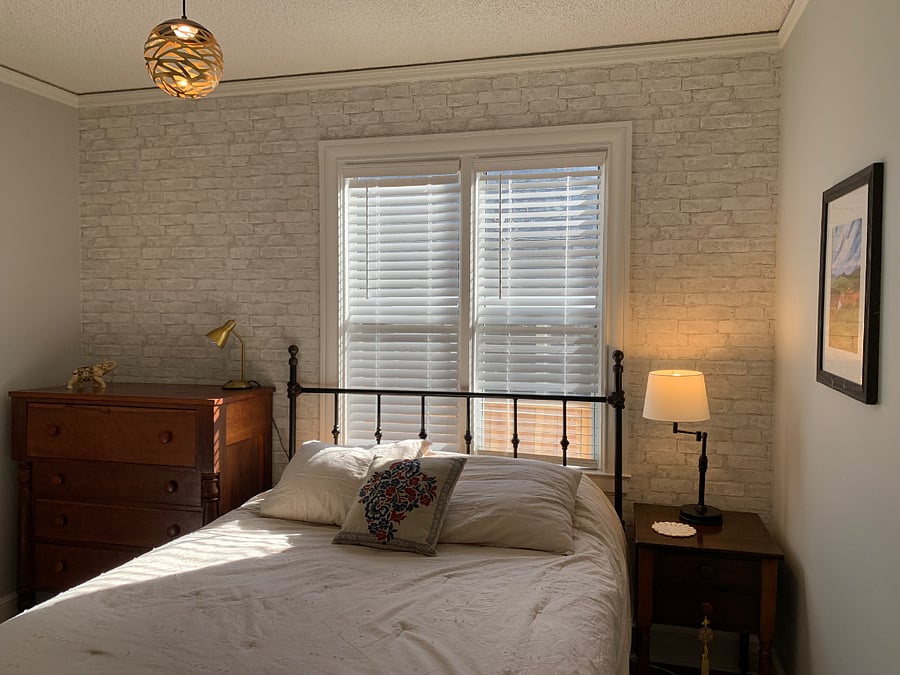 Primary bedroom w/ queen bed