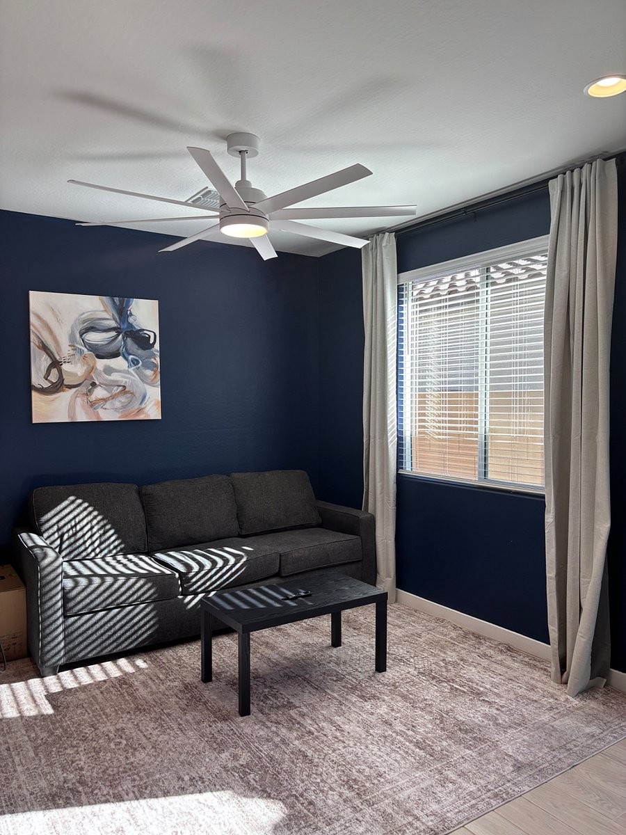 Living room with couch, TV and tea table
