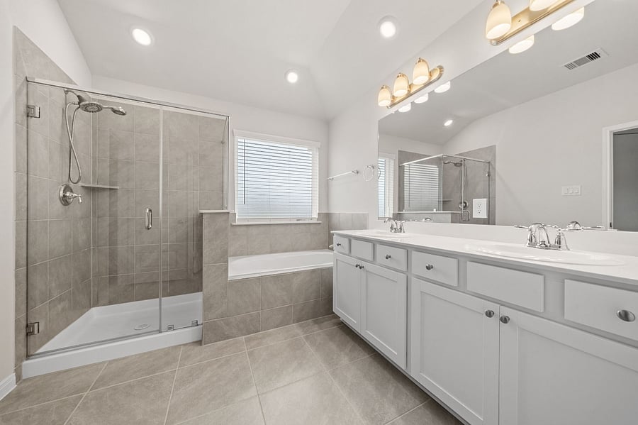 Elegant Primary Bathroom with Separate Tub and Shower and Dual Vanity Sinks