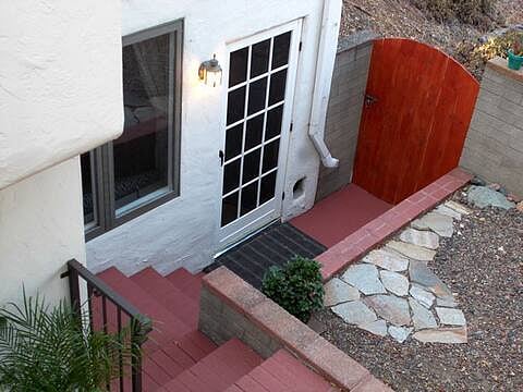 You'll go down these stairs into the apartment. (Gate to canyon is kept closed.)