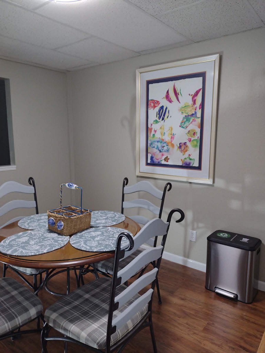 Kitchen/Dining area: Round glass topped table with seating for 4.