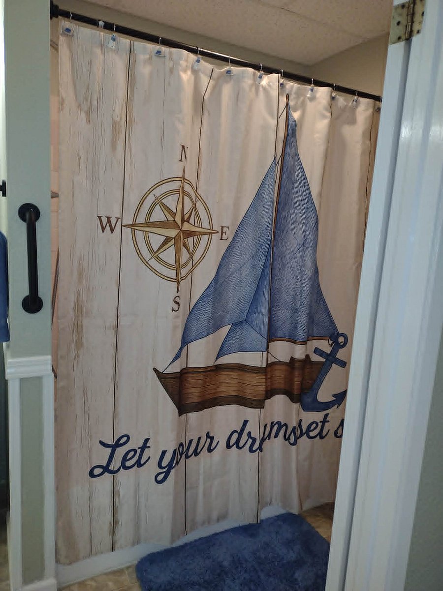 Let Your Dreams Set Sail!  Full sized professionally refinished tub with slip resistant  base - ceramic tile walls - Double headed shower provides adjustable flow/pressure from above or from the handheld magnetic sprayer. External safety grab bar