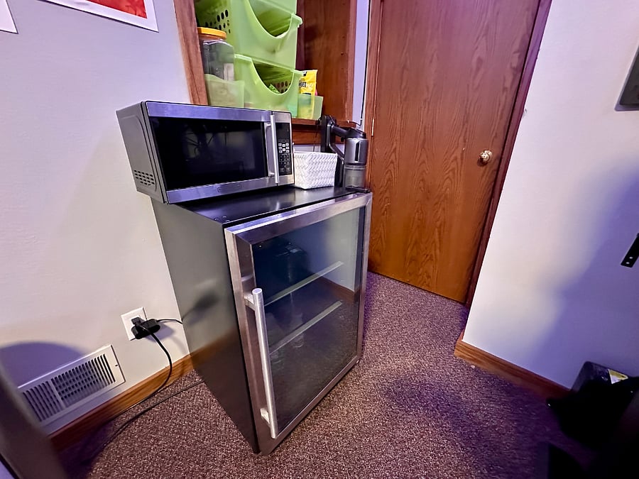 Mini-fridge, microwave and shelving storage for dry goods/food. There's a full size fridge in the garage you can use as well.