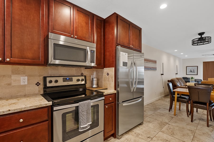 Fully equipped kitchen with stainless steel appliances, ample counter space, and everything needed for everyday cooking.