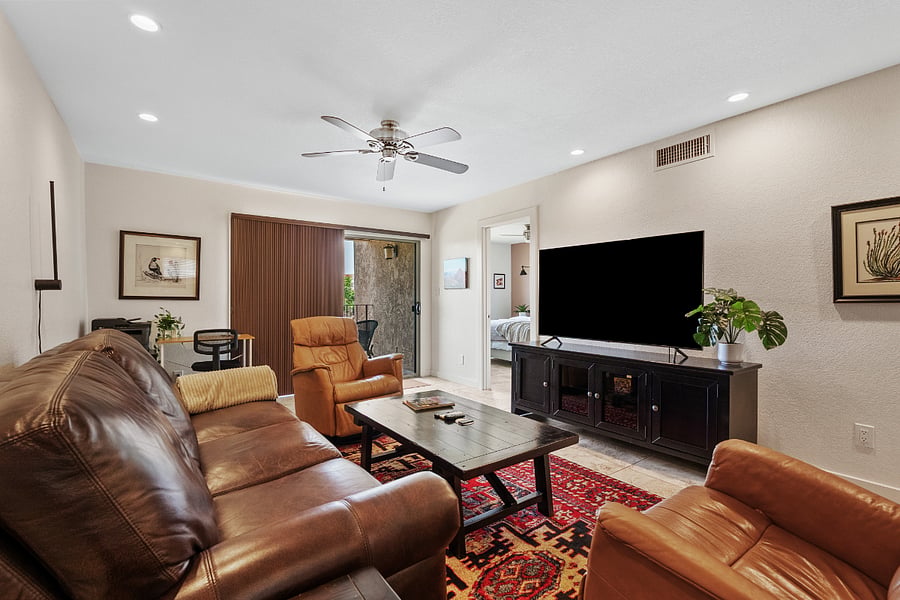 Spacious, fully furnished living room with smart TV and comfortable seating, ideal for relaxing stays in Scottsdale near Old Town.