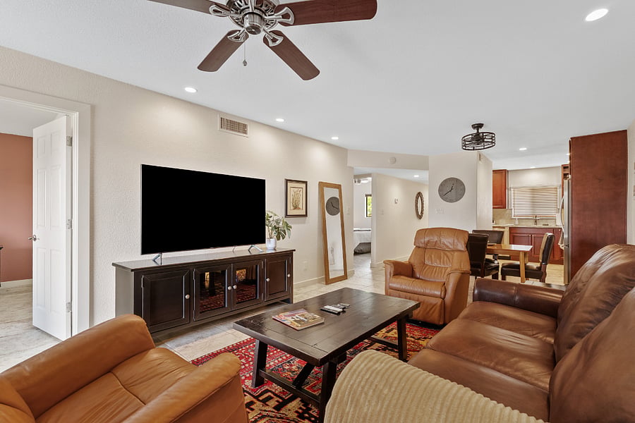 Spacious, fully furnished living room with smart TV and comfortable seating, ideal for relaxing stays in Scottsdale near Old Town.