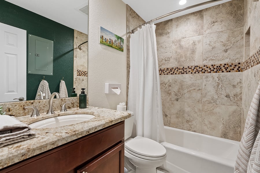 Bathroom 2 offers a spa-like feel with a full tub and shower, updated finishes, and a calm, relaxing atmosphere.