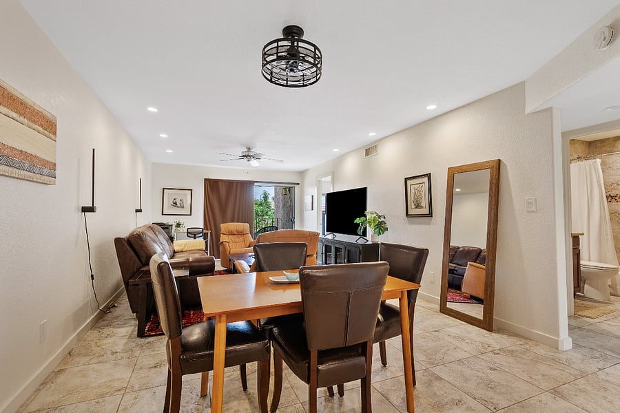 Open-concept Scottsdale condo with dining area, spacious living room, and private patio access, perfect for comfortable everyday living near Old Town.