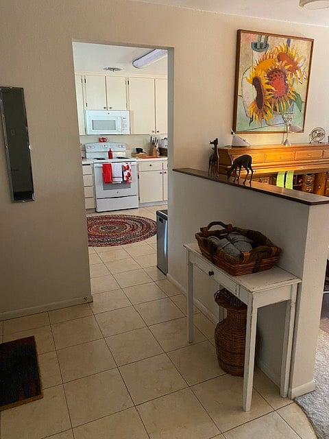 Shared front entrance opens to the kitchen and living room.