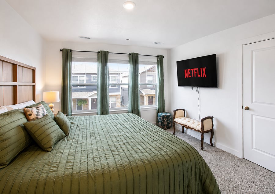 Master bedroom with king size bed and smart tv