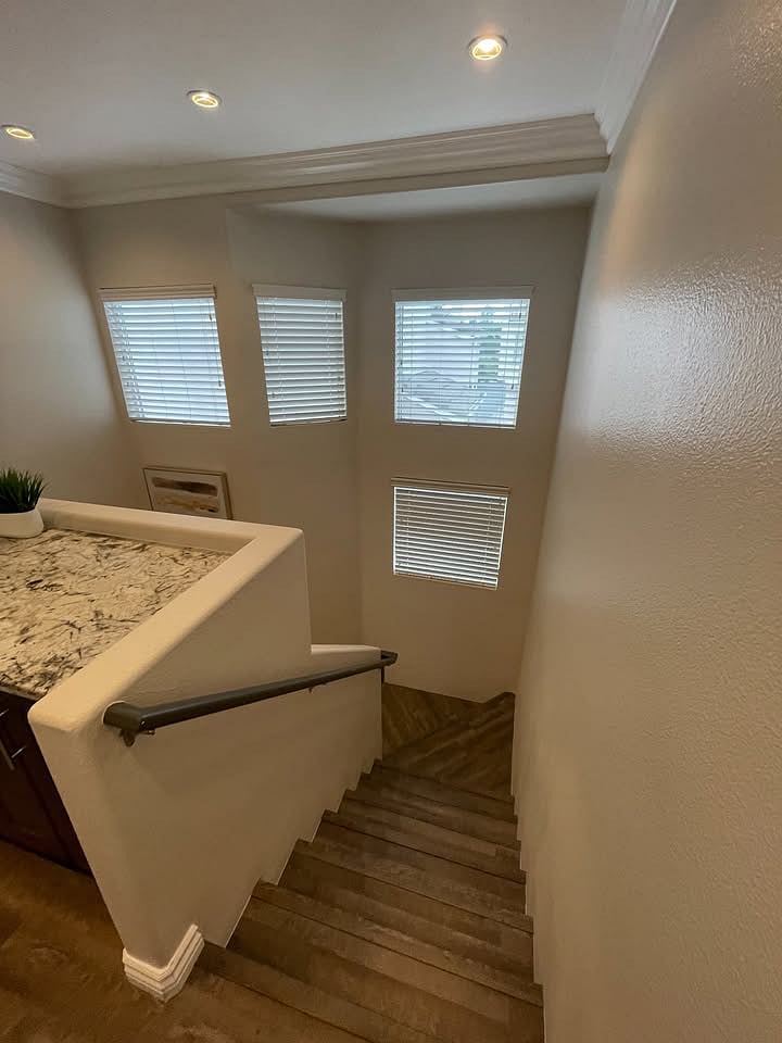Stairway to second level bedrooms and laundry - lots of natural light!