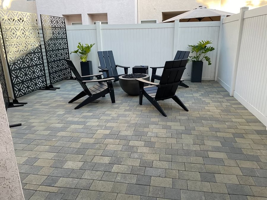 Spacious back patio with fireplace and chairs for you!