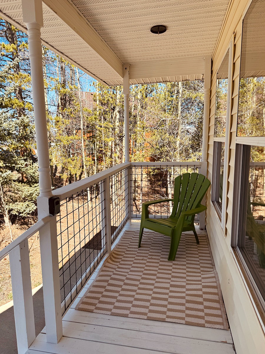 Front deck where front door to upper apartment is located.
