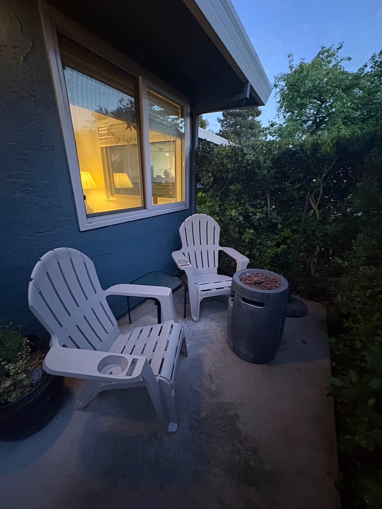 New chairs, umbrella, and fire pit