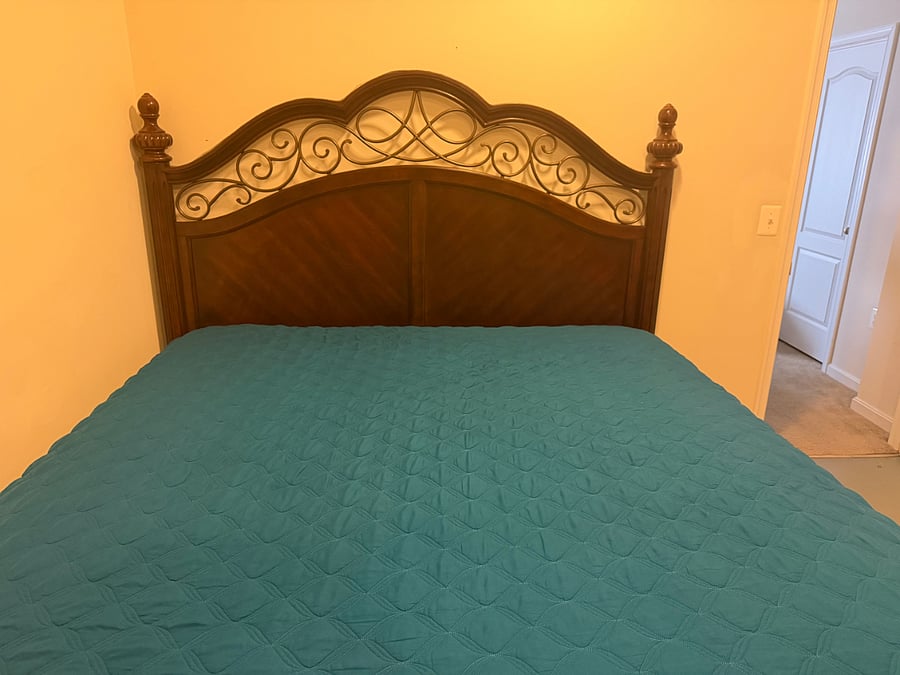 King side bed with pillow top mattress.