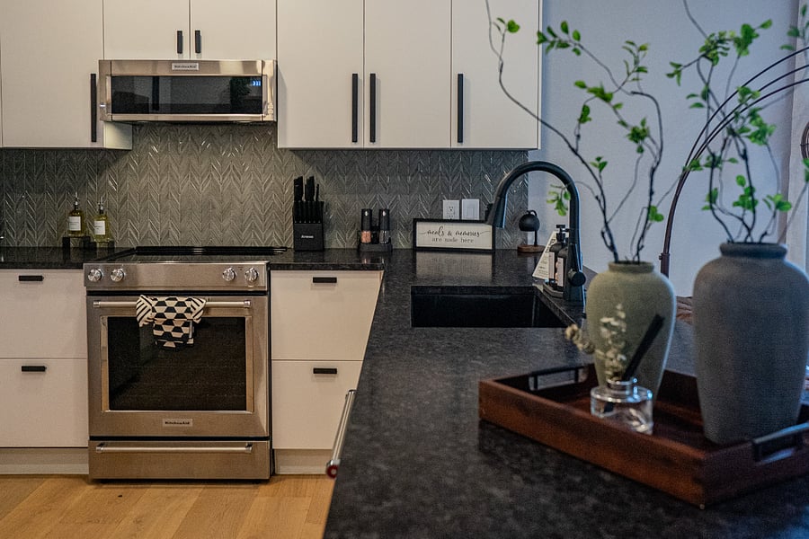 Kitchen with Stainless Steel Oven & Dark Countertops