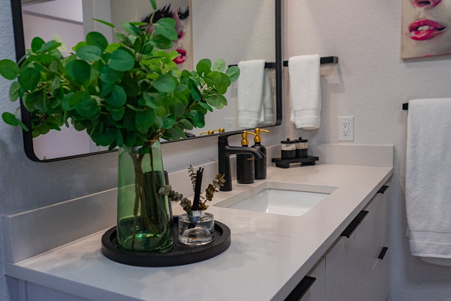 Bathroom Vanity with Green Glass Vase
