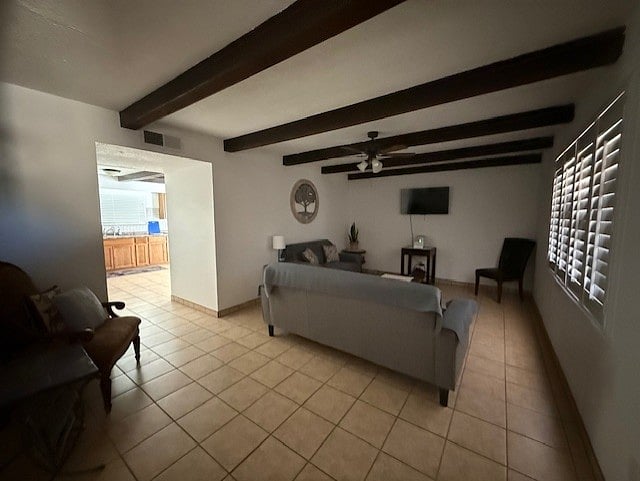 Couch, loveseat, coffee table, TV and extra seating in living room.
