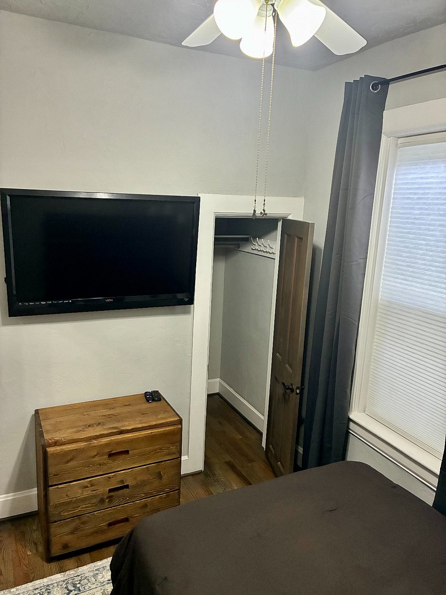 2nd Bedroom includes full bed, dresser, and 50" smart TV.