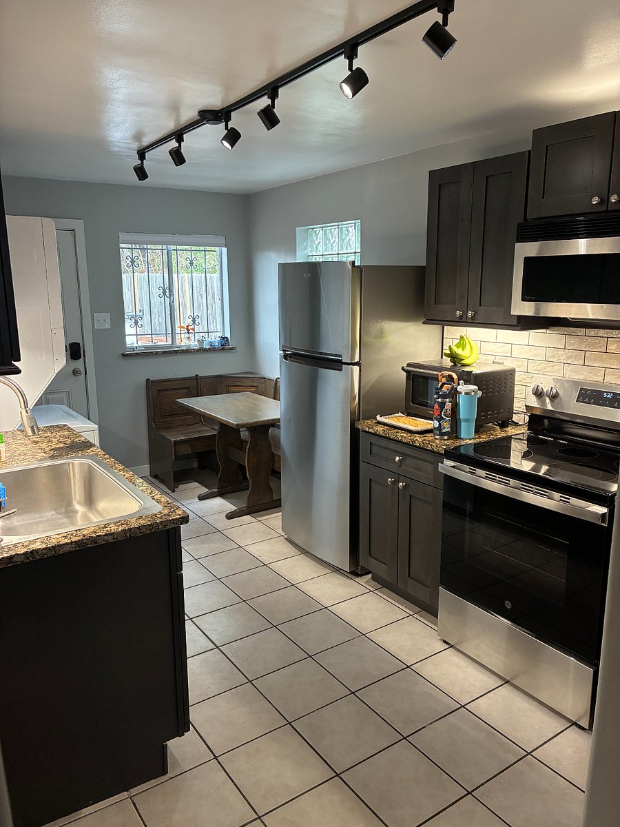 Kitchen includes breakfast nook and stainless steel appliances.