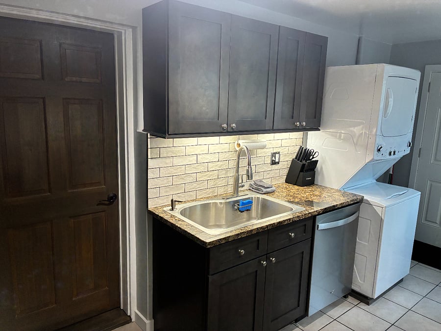 Kitchen with washer and drier.