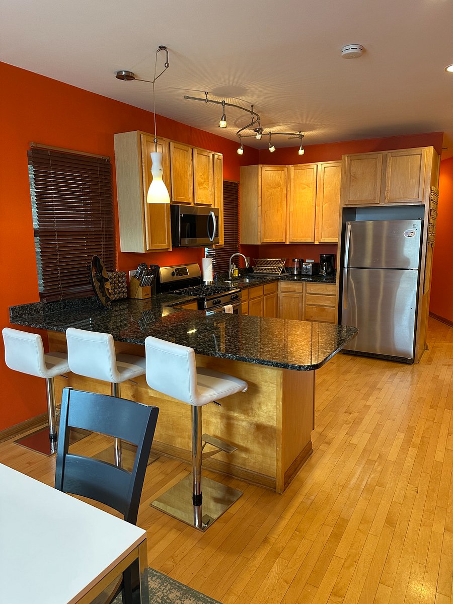 Full kitchen with stainless appliances, island seating, and real counter space built for guests who plan to actually cook and settle in.