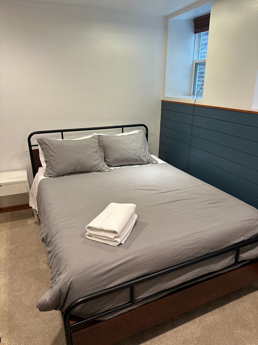 Comfortable private bedroom with fresh linens, bedside storage, and a quiet layout for restful stays.