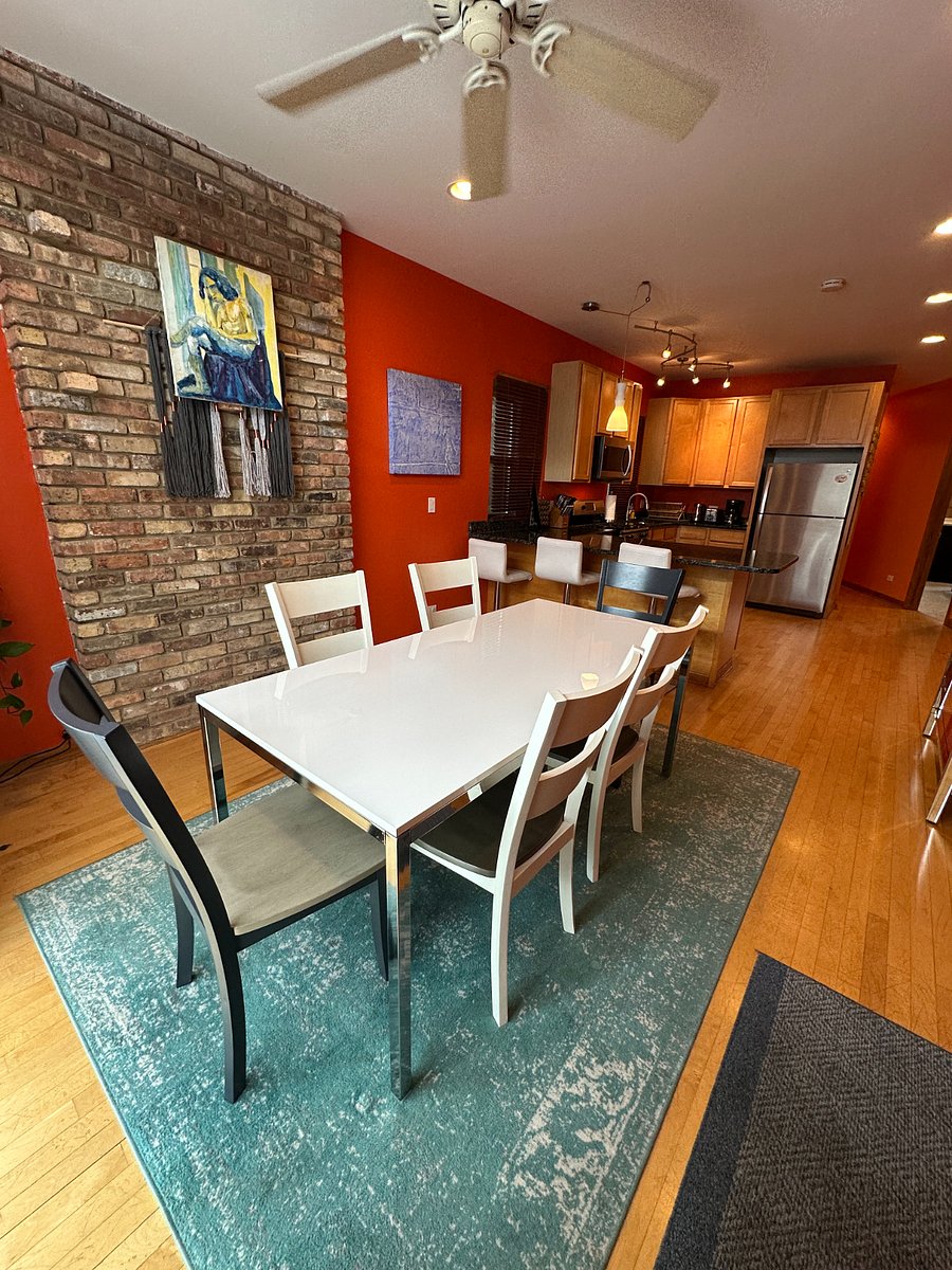 Dedicated dining area just off the kitchen great for meals, laptops, board games, or gathering with family between Chicago plans.