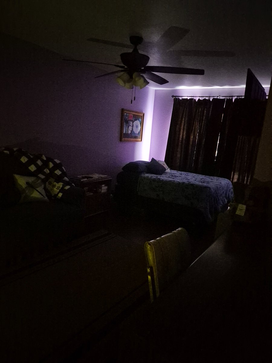 CLOSED CURTAINS KEEPS SUNLIGHT OUT; LIGHTS OFF
