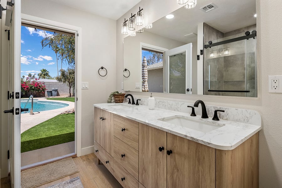 Spa Bathroom featuring a Rainfall Shower with Poolside Access