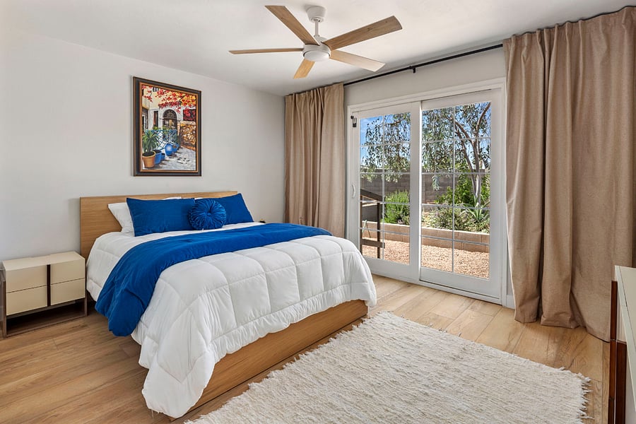 Garden Retreat: This tranquil bedroom features direct views and private access to the lush backyard greenery. A peaceful, sun-filled sanctuary perfect for those who want to wake up to nature