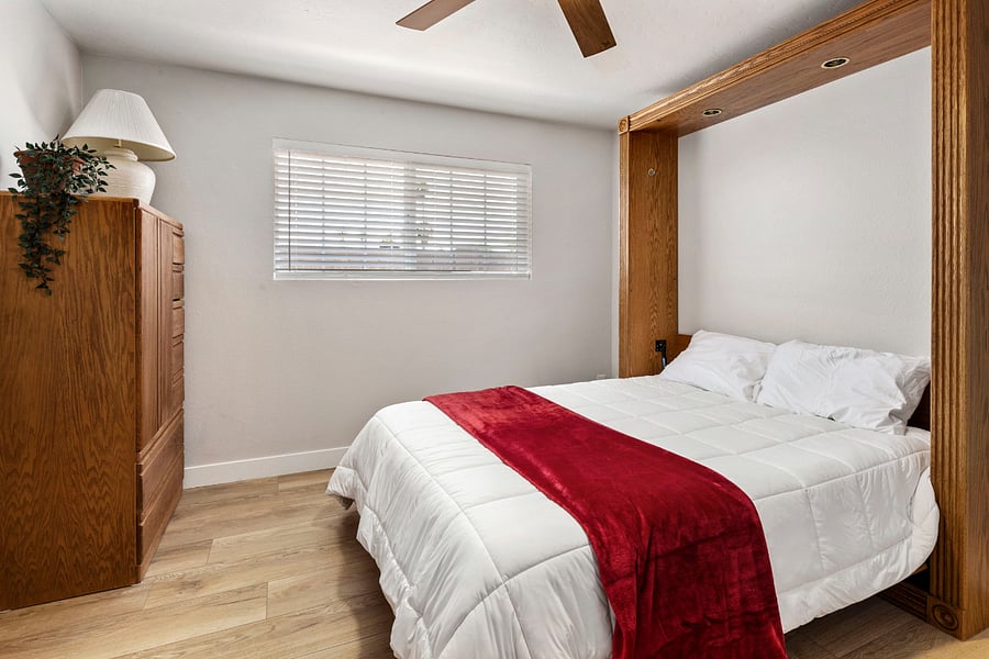 The Ultimate Flex Space: Designed for the modern professional, this room features a dedicated workspace with a desk and a Murphy bed. Transform it from the office into a comfortable 4th bedroom in secondsperfect for visiting guests or a quiet place to chart.