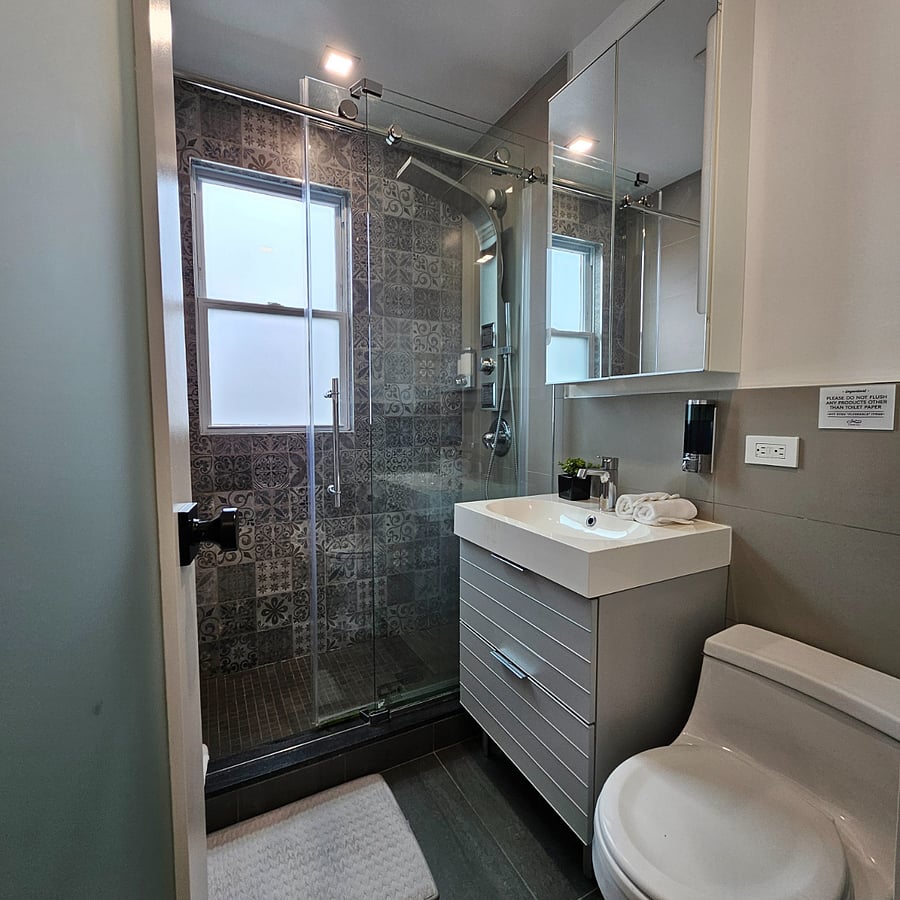 Clean, modern bathroom with fresh towels provided
