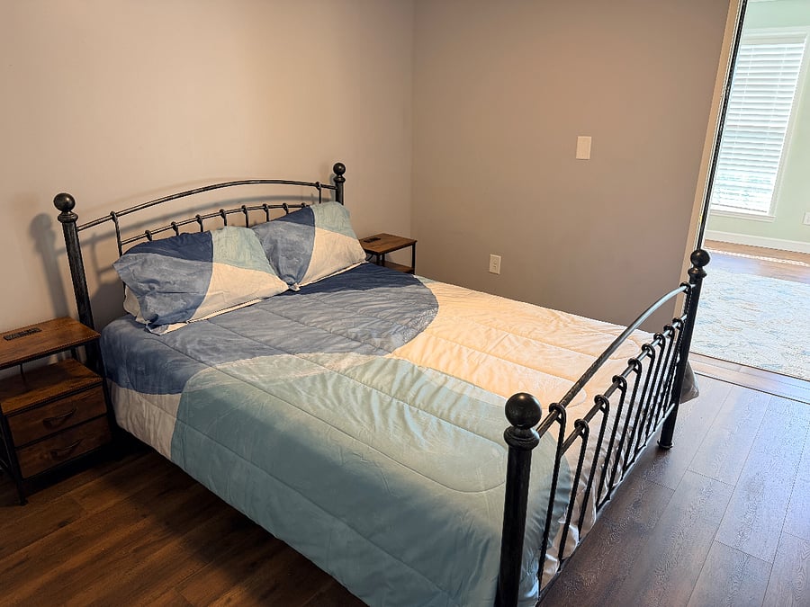 Second bedroom with queen bed and powered night stands.