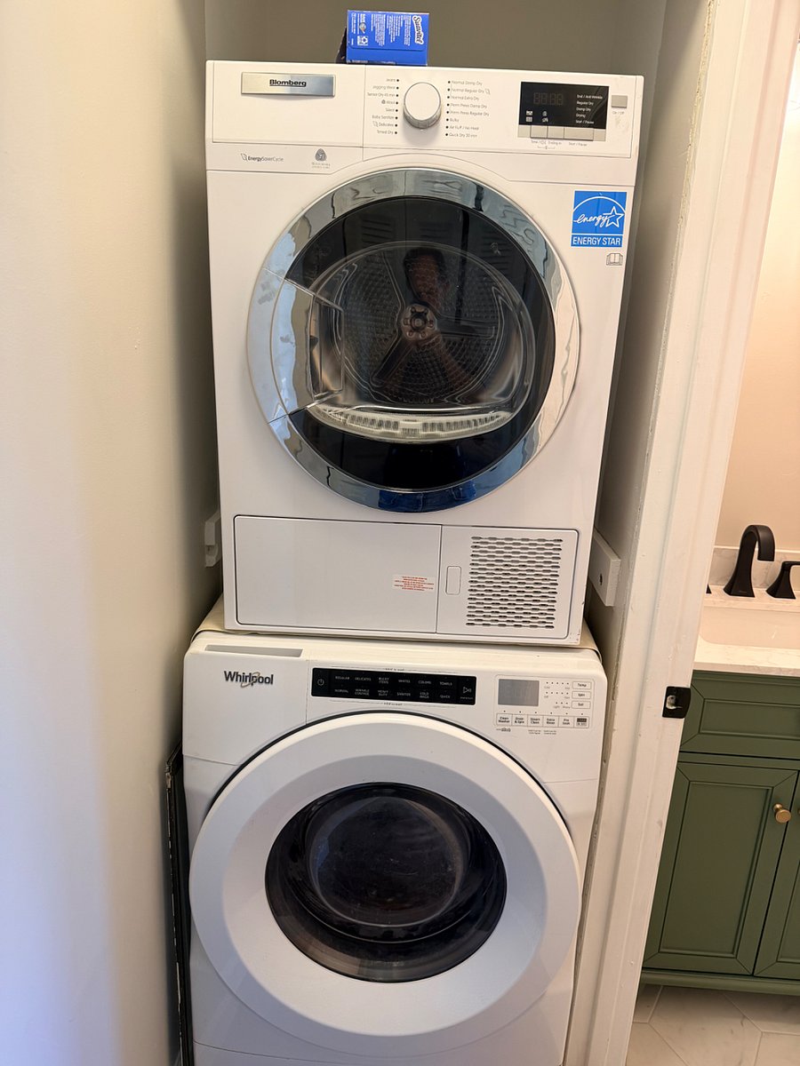 Stacked washer and ventless dryer in-unit.
