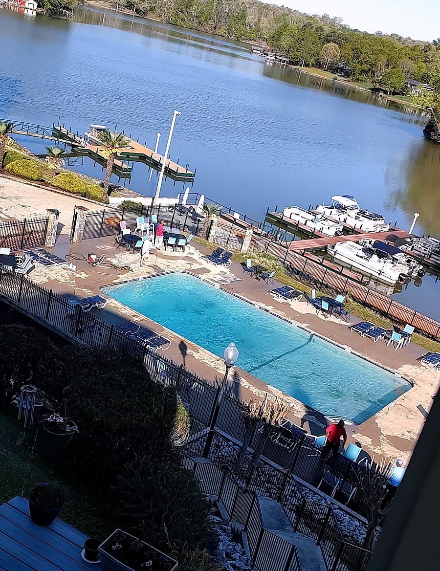 Pool has a view to the lake and boat slips that are private to the community.