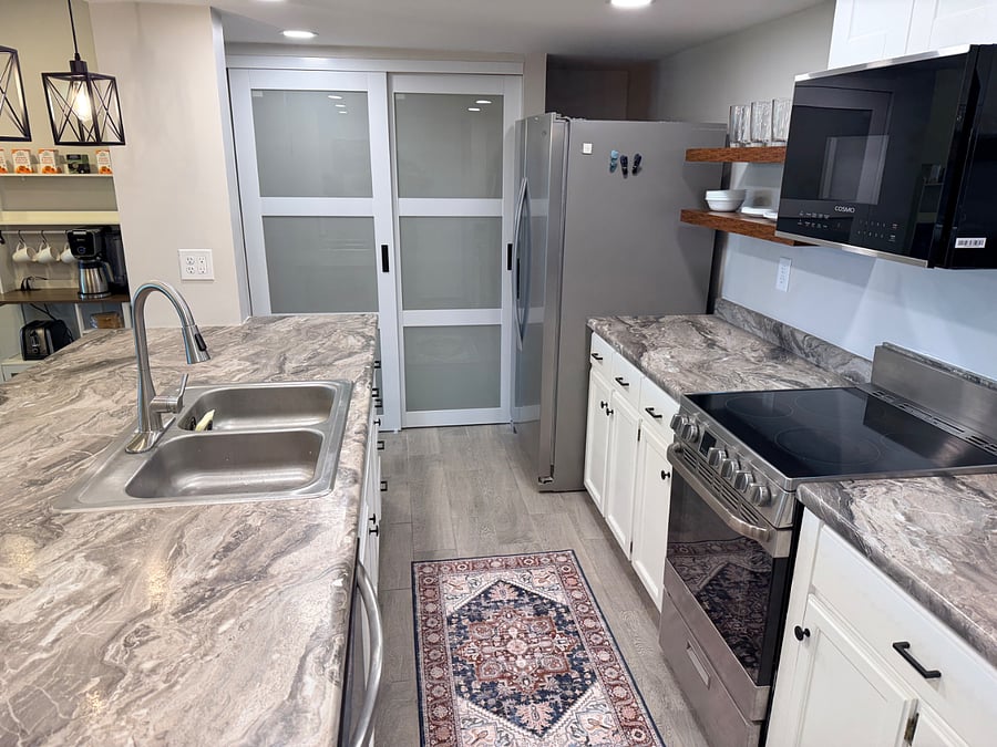Full size kitchen, refrigerator, brand new (5/26) dishwasher, and brand new (5/26) microwave.