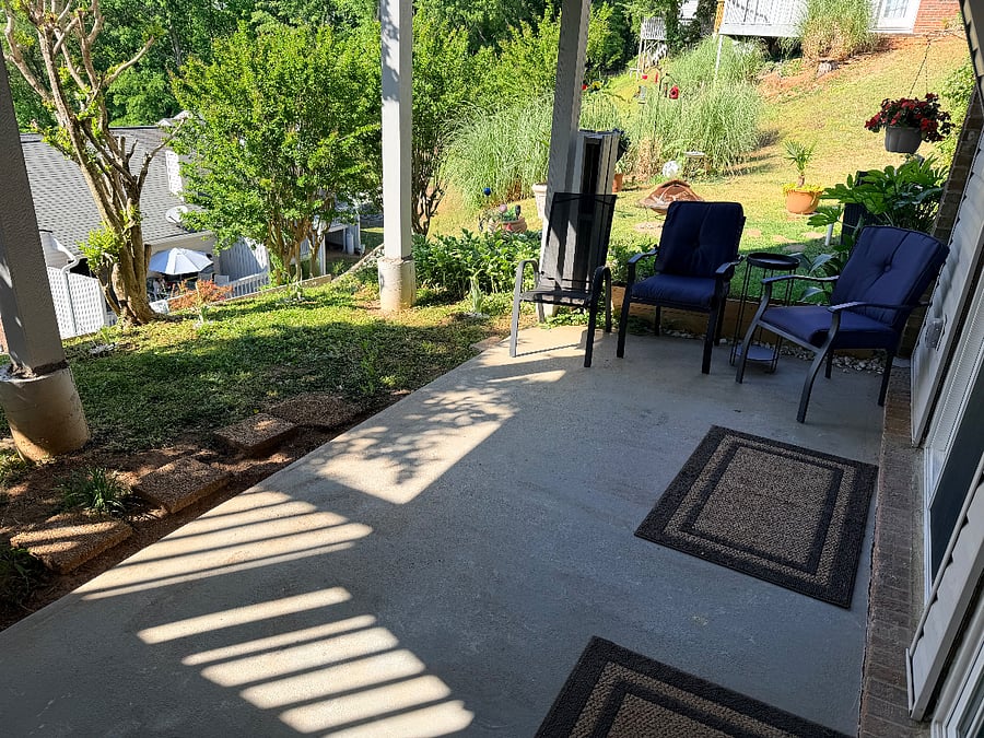 Covered patio off the living room. Nice relaxing and enjoying the view.