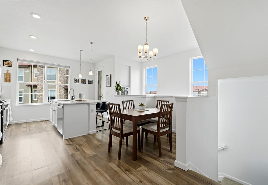 Open Kitchen and Dining area perfect for hosting and catching beautiful Colorado sunsets over the mountains.