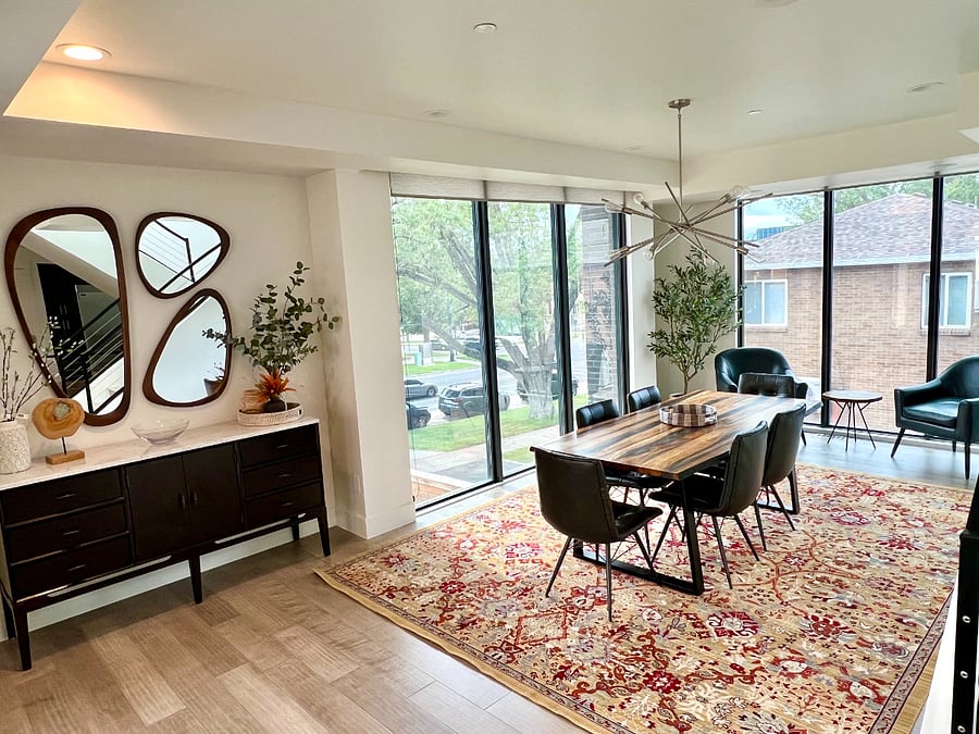 Very large dining room with floor to ceiling windows on three sides for beautiful natural light