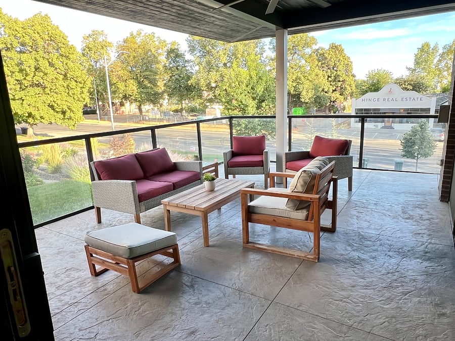 Dining room and living room have large sliding glass doors that open onto a huge second level patio deck. Outdoor seating for 6, along with a gas grill and ceiling fan.