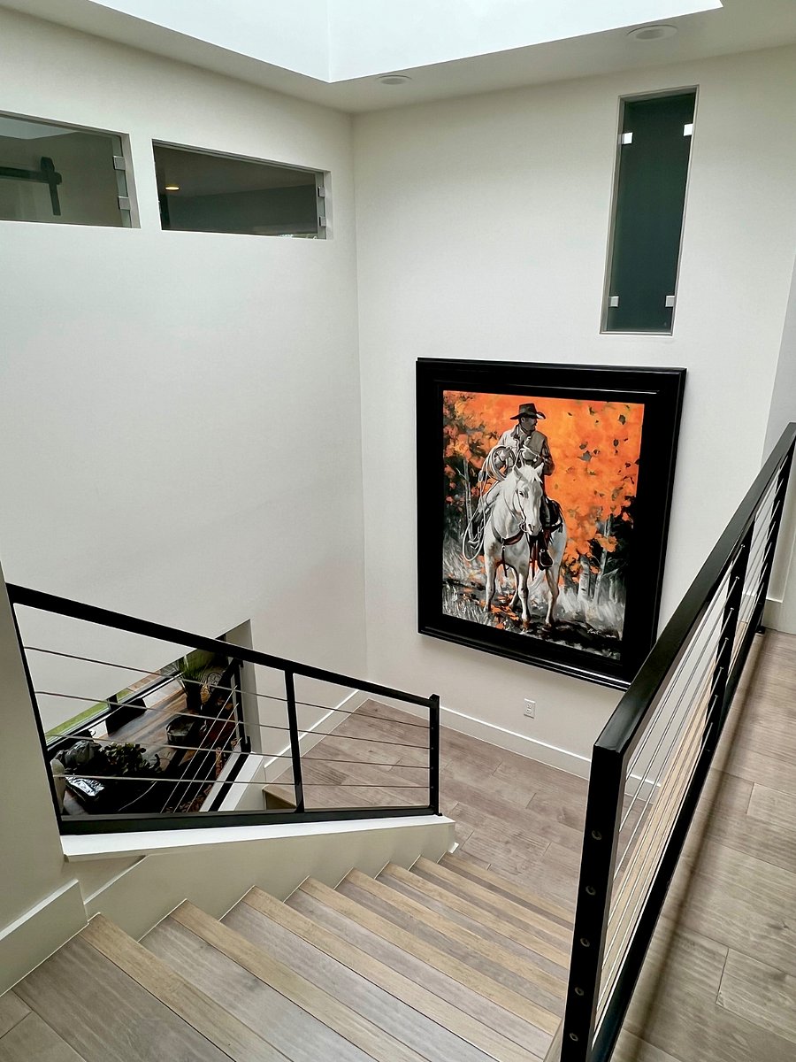 Large open staircase from second to third floor, with skylight overhead.