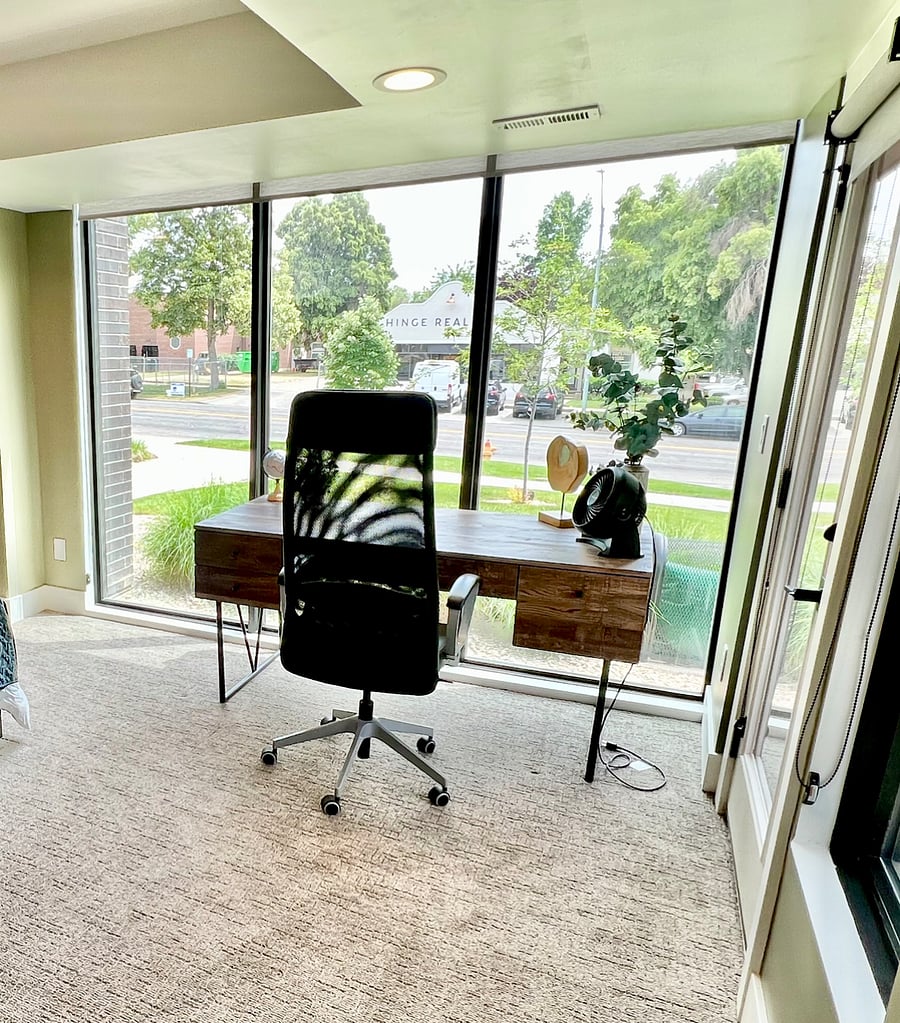 Workspace in entry level bedroom with outdoor views.