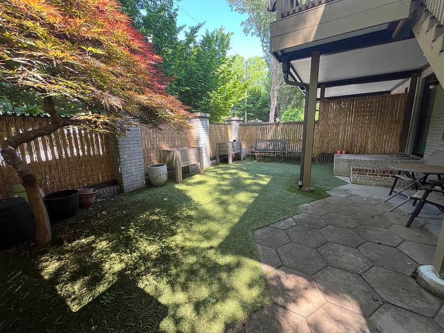 Private, fenced-in yard with artificial turf